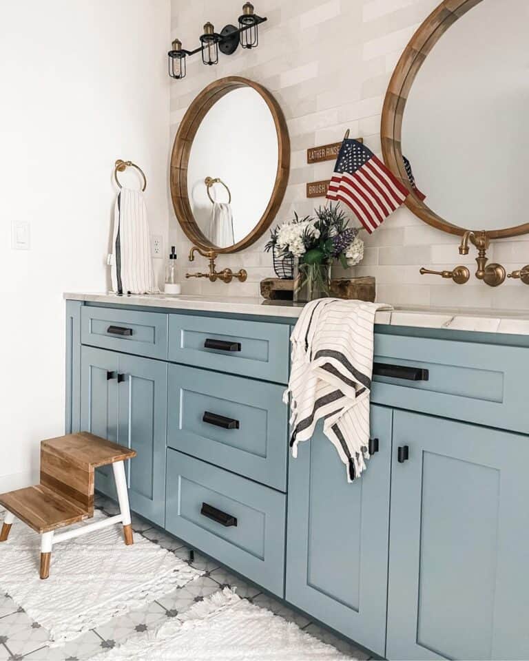 Modern Blue and Natural Stone Bathroom with Black Hardware