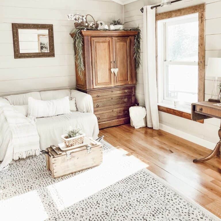 White Pillows Under a Gold Mirror