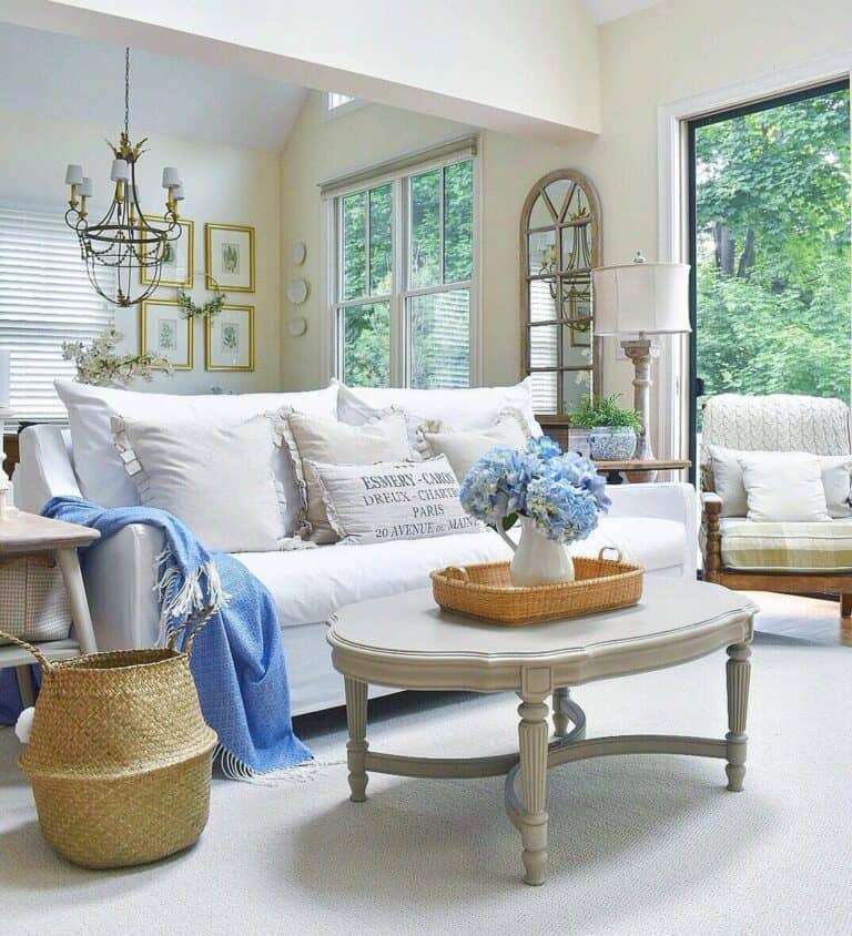 White Couch with Blue Flowers and Blankets