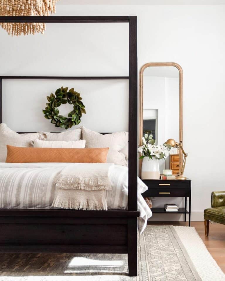 Canopy Bed and Mirror Behind Nightstand