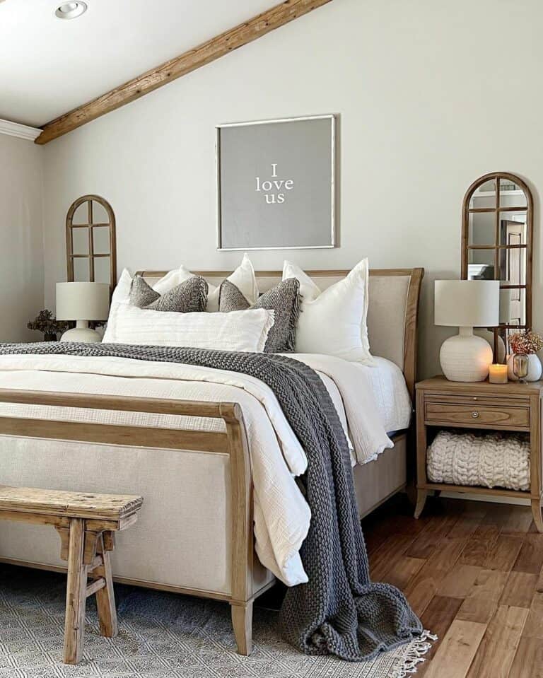 Slanted Ceiling Bedroom with Arched Wood Mirrors