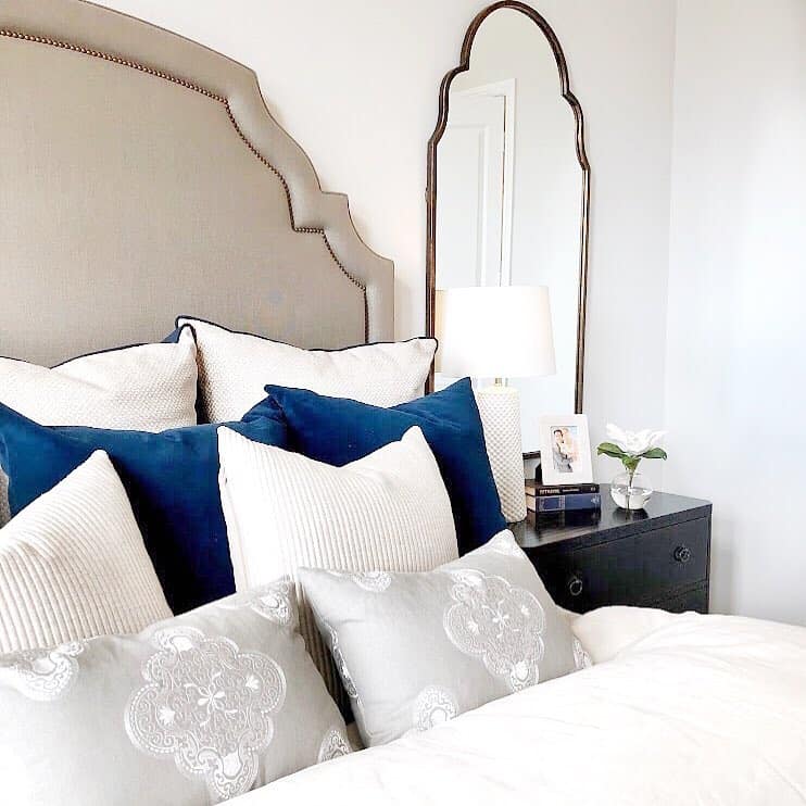 Blue and Gray Pillows on White Bedding