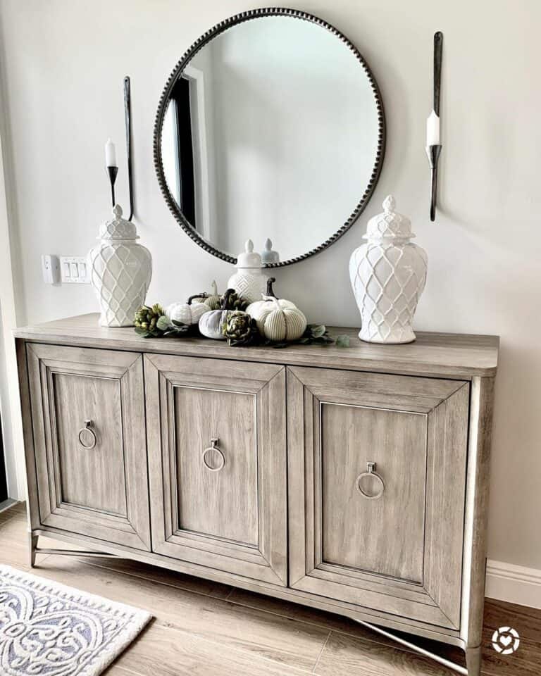 Three White Porcelain Jars on Wood Side Table