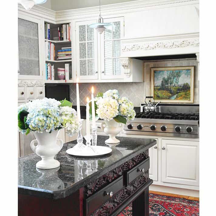 Two White Urn Vases with Bouquets