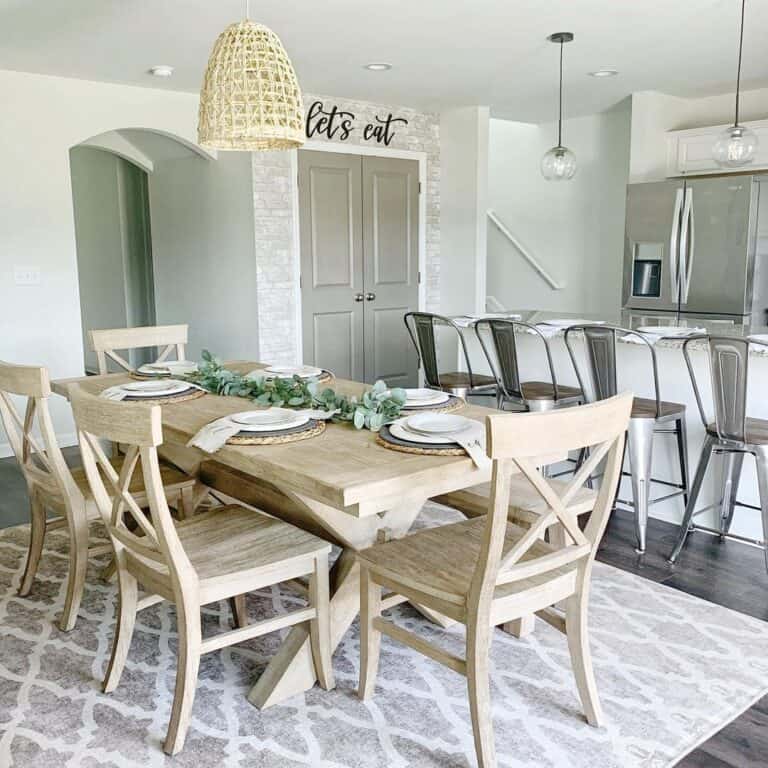 Light Yellow Rattan Pendant Lamp Over Table Set for Dinner