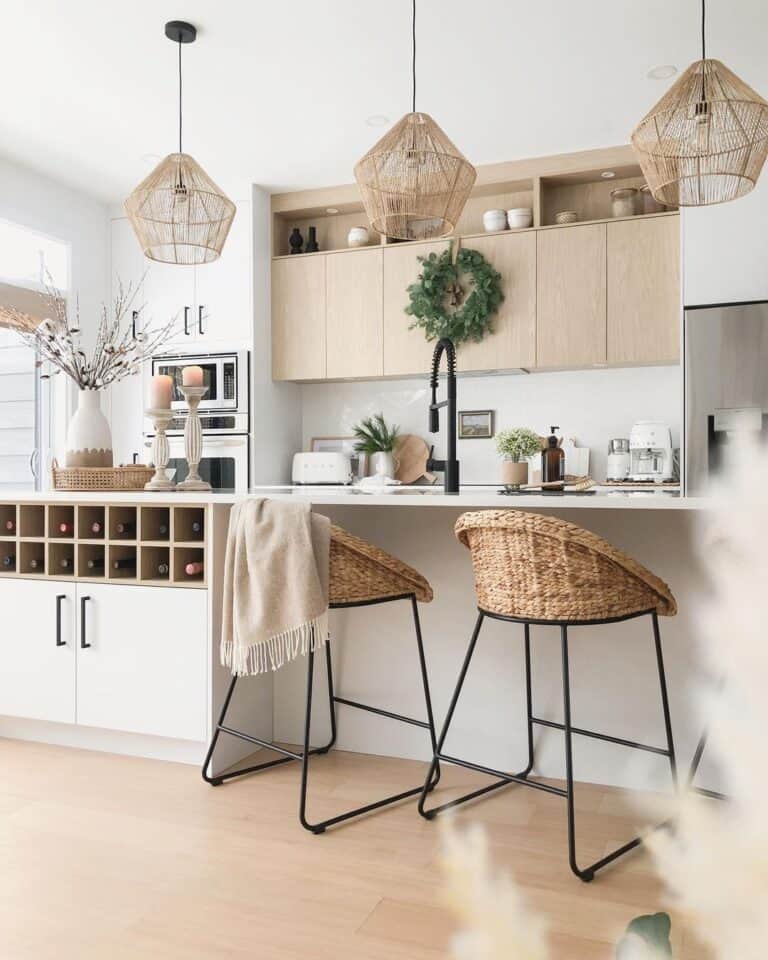 Loosely Woven Rattan Hanging Lamps Over a Black Gooseneck Faucet