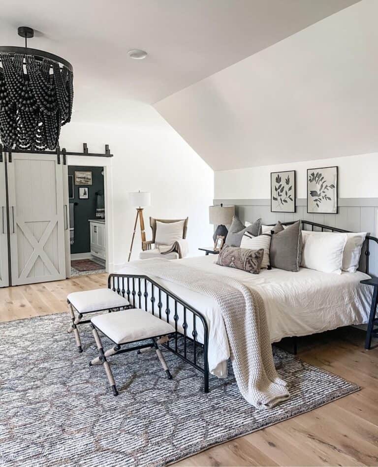 Low Sloped Ceiling Bedroom with Black Chandelier