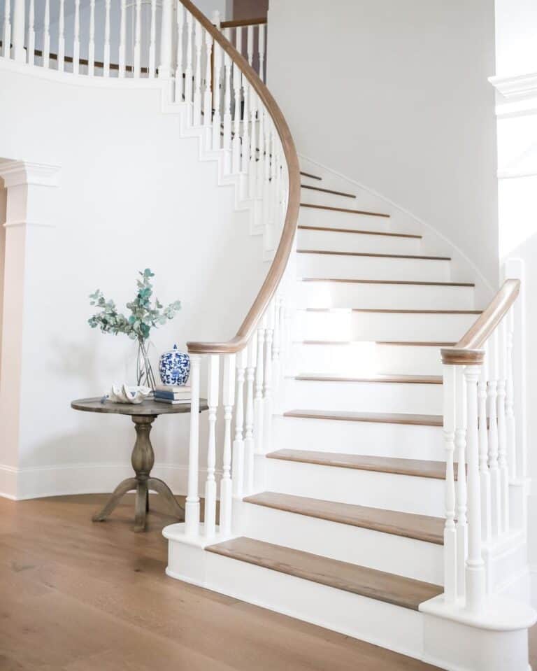 White Baseboard Contrasts with a Medium-Dark Wood Floor