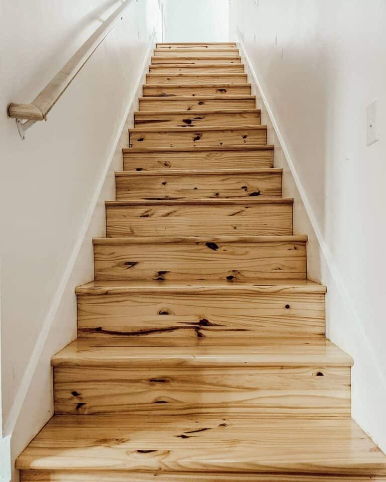 Light Wood Staircase with White Stair Skirt Boards