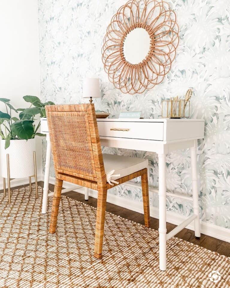 Mirror With a Large Gold Frame Over a White Desk