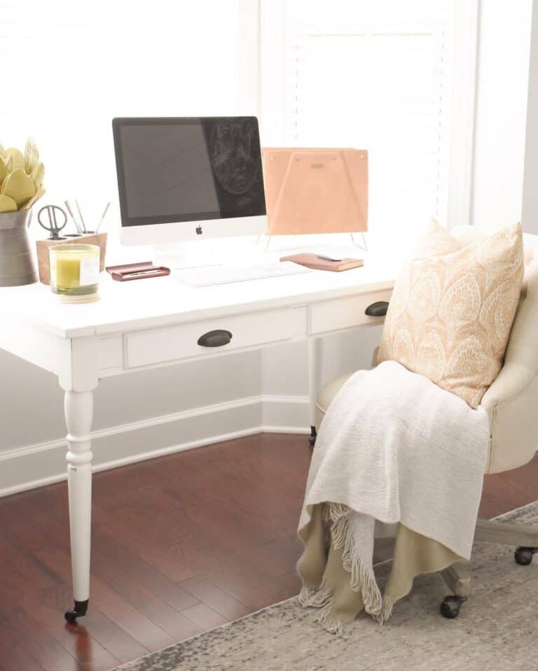Bay Window Illuminates a White Modern Desk With Drawers