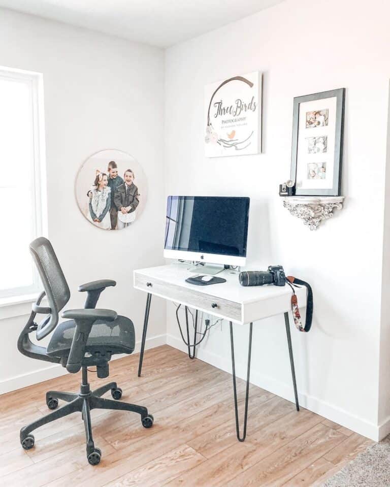 A Camera on a White Modern Desk With Drawers